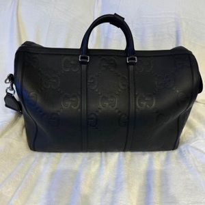 Authentic black Gucci duffle bag.